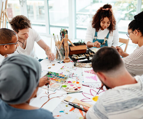 Creative people around a table